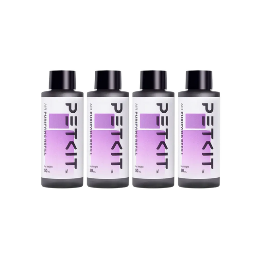 Vier PETKIT Air Purifying Refill flessen in zwart met paars etiket.